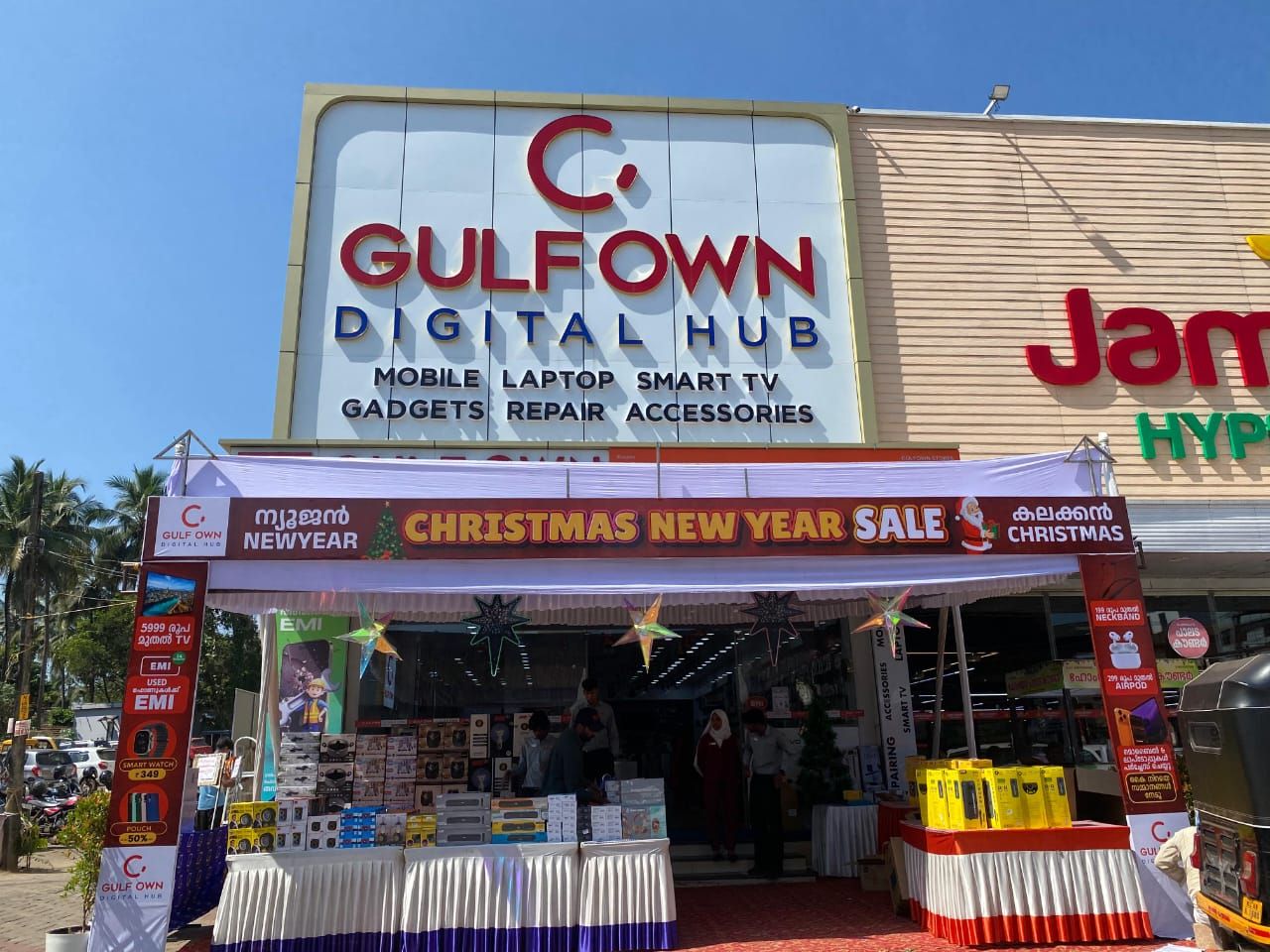 Storefront signage and sale branding for Gulfown Digital Hub in Kerala